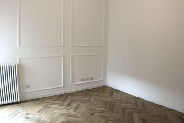 operazione immobiliare Bergamo | frazionamento ufficio e cambio uso in abitativo | bilocale | boiserie | Bergamo